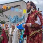 Richard Stephens as Shakespeare speaks to the audience at OTAs Renaissance Faire as Queen Gertrude and her advisor Polonious approach Sequim Gazette photo by Emily Matthiessen