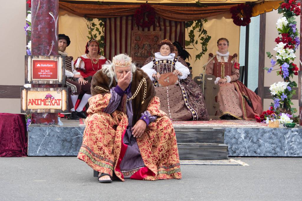 Mark Valentine, as King Lear, portrays a scene at Olympic Theatre Arts Kings, Queens, & Royal Scenes, A Renaissance Faire on Aug. 22. Looking on are, from left, Matt Forest as the squire to the Queen, Susan Cates as Goneril, Patricia MacArthur as Queen Elizabeth I and maid-in-waiting played by Merrin Packer. Sequim Gazette photos by Emily Matthiessen