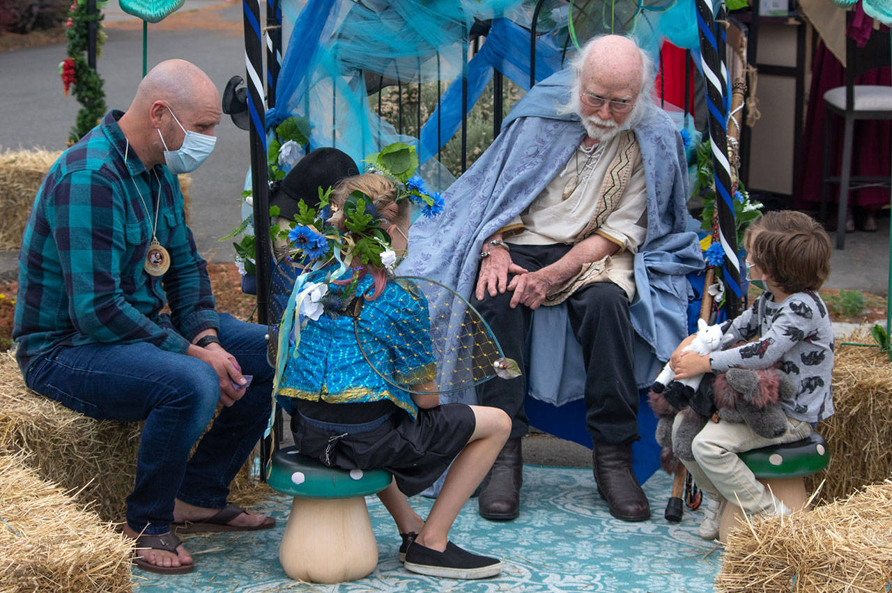 James the Obscure Hodgson, a storyteller since 1968, entertains a rapt audience on Aug. 22 in the parking lot of Olympic Theatre Arts in Sequim during their Renaissance Fair fundraiser. Sequim Gazette photo by Emily Matthiessen