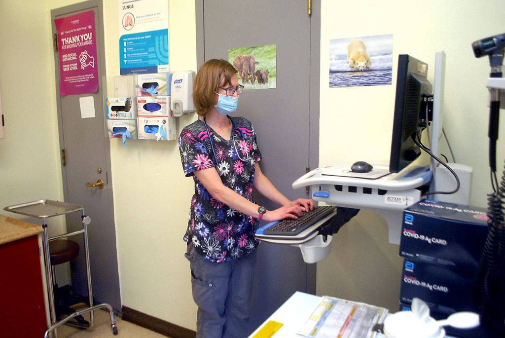 Nicki McCann, staff nurse at the Clallam County Jail, works in a cramped examination room at the jail on Aug. 25. Photo by Keith Thorpe/Olympic Peninsula News Group