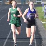 A classic Sequim-Port Angeles match-up that didnt get to shine on the state level last year: PA and Sequim standouts Lauren Larson and Riley Pyeatt go toe-to-toe in the 800-meter race on March 31 in Sequim. The pair competed in same races more than a dozen times, but health restrictions nixed a chance for both to vie for district and state titles in 2020-2021. Larson graduated in 2021, while Pyeatt looks for strong finishes in cross country and track in 2021-2022, her senior year. Sequim Gazette file photo by Michael Dashiell