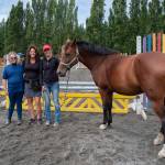 Shay Lucier, Martha Vaughan and Shelby Vaughn stand with Cassie the hourseat Fox-Bell Farms, Port Angeles, during a student show day. Lucier, referred to as Shelbys oldest student by a number of attendees, has been learning conscientious horse care with Shelby since before Shelby bought the farm. Sequim Gazette photo by Emily Matthiessen