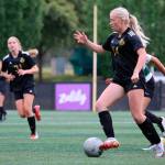 Peninsulas Alexis Harris, right, is on the attack as teammate Mya Raunig (31) trails the play in PCs 11-0 win over Chemeketa on Aug. 24 in Tukwila. Photo by Rick Ross/Peninsula College