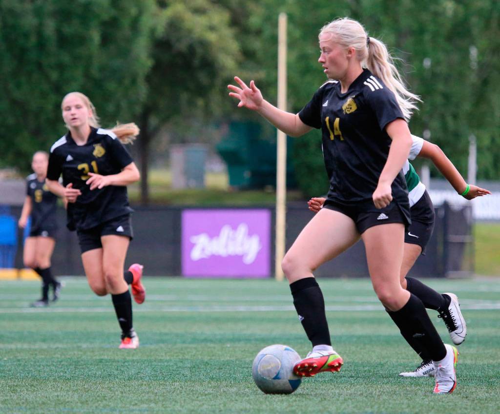 Peninsulas Alexis Harris, right, is on the attack as teammate Mya Raunig (31) trails the play in PCs 11-0 win over Chemeketa on Aug. 24 in Tukwila. Photo by Rick Ross/Peninsula College