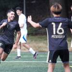 Peninsula forward Jonathon DeMotta, left, celebrates a first half goal with teammate Hayahide Sakamoto (16) in the Piratess 2-0 win over Lane on Aug. 24 in Tukwila. Photo by Rick Ross/Peninsula College