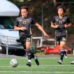 Left: Peninsulas Don Vaios (center) advances the ball in the Pirates 2-0 win over Lane on Aug. 24. Looking on are teammates Sean Donaldson, left, and Shu Kato. Photo by Rick Ross/Peninsula College