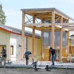 Construction continues at the newly-renamed Dungeness River Nature Center in late August. Workers with Hiday Concrete, Inc., work on the patio that will more than double the original outdoor entrance space, river center officials noted last week. The center, undergoing a multi-million-dollar expansion, is expected to reopen this fall. Sequim Gazette photo by Michael Dashiell