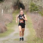 Sequim junior Riley Pyeatt breaks out to a big lead as she helps the Wolves with a one-point win over Klahowya at Voice of America Park on March 6, Sequims lone home meet of the abbreviated 2020-2021 season. Sequim Gazette file photos by Michael Dashiell