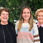 Sequim High graduate Kalli Wiker, center, accepts a scholarship from the Sequim P.E.O. Chapter HM. Pictured with Wiker are, from left, Pam Grandstrom, Charlotte Hudson, Shirley Sutterlin and Nancy Gilchrist. Submitted photo