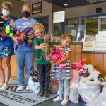 Holding animals sewn by Sequims Fiber Arts Neighborhood Group are, from left, Monica Dixon of the Sequim group, which is part of the American Sewing Guild; Tessa Jackson, director of the Sequim unit of the Boys Girls Clubs of the Olympic Peninsula; Nick, 5; and Josie, 4; of Great Futures Preschool, housed at the Sequim unit. Sequim Gazette photo by Emily Matthiessen