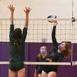 Sequims Kelsi Bergeson, right, looks to hit past Port Angeles Ava Hairell in the second game of the Wolves 3-1 win over the Roughriders on Sept. 9. Sequim Gazette photo by Michael Dashiell