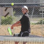 Sequims Garrett Little returns a shot in the first set of a 6-0, 6-0 win over Bremertons Jackson Warner on 
Sept. 9.