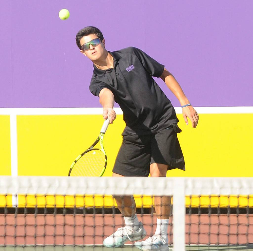 Sequims Henry Hughes returns a shot in a Sept. 9 league matcha against Bremerton. Sequim Gazette photo by Michael Dashiell