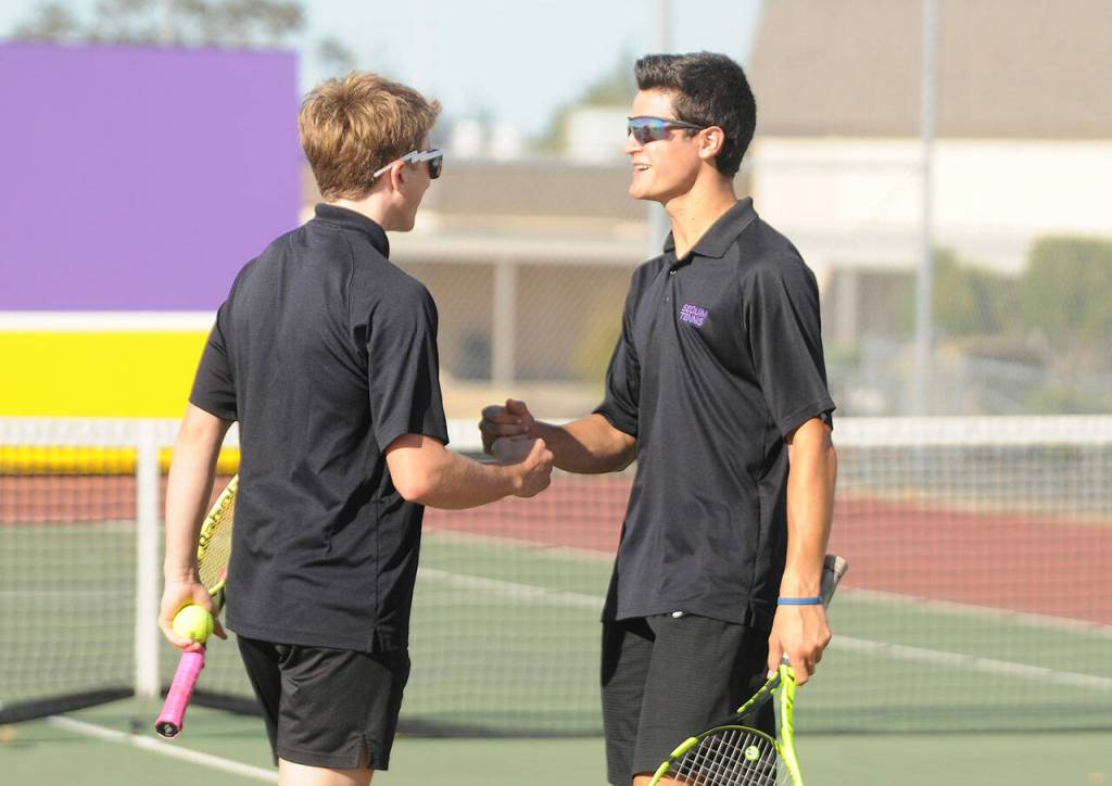 Sequims Jack Van DeWege and Henry Hughes celebrate a point in the first set of a 6-3, 6-3 win over Bremertons Casey Pritchard and Sandro Tang on Sept. 9. Sequim Gazette photo by Michael Dashiell