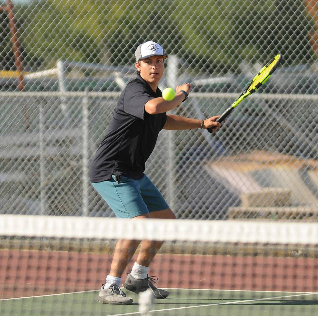 Sequims Espn Judd returns a shot as he and doubles partner Kaiden Jones earn a straight set win against Bremertons Nico Crowley and Nate McClain on Sept. 9. Sequim Gazette photo by Michael Dashiell