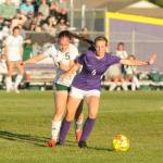 Port Angeles Mia Gagnon, left, and Sequims Rileigh VanDyken battle for possession in the first half of an Olympic League match. The visiting Roughriders won, 3-1.