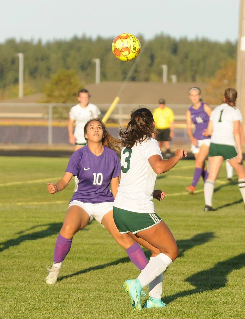 Sequims Jennyfer Gomez (10) looks to trap the ball as Port Angeles Hannah Reetz looks on in an Olympic League match-up on Sept. 9. Port Angeles topped the host Wolves, 3-1. Sequim Gazette photo by Michael Dashiell