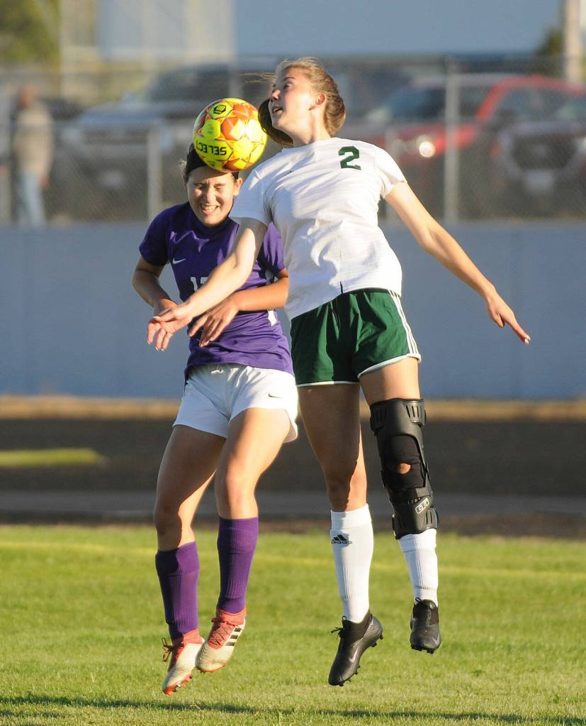 Sequims Kaia Lestage, left, and Port Angeles Catie Brown vie for the ball in the first half of the Roughriders 3-0.