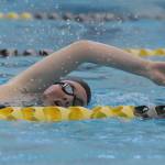 Above: Sequims Natalie Cross competes in the 200 freestyle event Sept. 9 in a season-opening meet versus Bainbridge. Right: Sequims Lauren Sundin competes in the backstroke portion of the 200 medley relay.