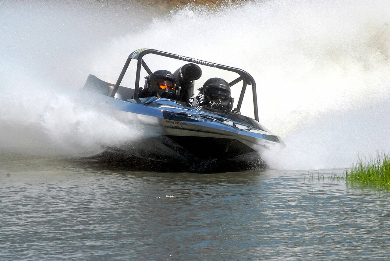 Team Kiwi, driven by Chris Munro and navigated by Katie Munro, competes at the Extreme Sports Park in Port Angeles. The team won the Unlimited Class at Julys first sprint boat race of the summer. Photo by Keith Thorpe/Olympic Peninsula News Group