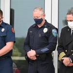 Clallam County District 3 Cpt. Chris Turner, Sequim Deputy Chief of Police Mike Hill and District 3 assistant chief Tony Hudson observe a moment of silence at a 9/11 ceremony in Sequim Friday morning. Sequim Gazette photo by Michael Dashiell