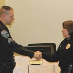 Sgt. John Southard receives congratulations on his recent retirement from Sequim Police Chief Sheri Crain.