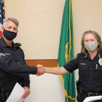 Jeff Thaxton accepts a promotion to patrol sergeant from Sequim Police Chief Sheri Crain. Photos courtesy of City of Sequim