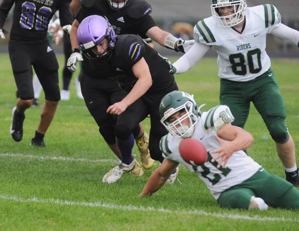 Port Angeles Daniel Cable recovers a first-half fumble by Sequim during the Rainshadow Rumble rivalry game Friday. Sequim Gazette photo by Michael Dashiell