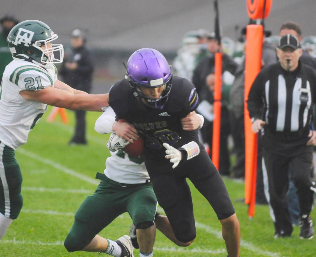 Sequims Isaiah Moore adds run-after-catch yardage while Port Angeles defenders including Daniel Cable, left, attempt to haul him down during a Rainshadow Rumble rivalry game on Sept. 17. Sequim Gazette photo by Michael Dashiell