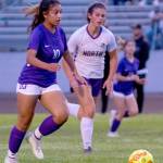 Sequims Jennyfer Gomez, left, advances the ball in the first half of the Wolves 2-0 win over visiting North Kitsap on Sept. 16. Sequim Gazette photo by Emily Matthiessen