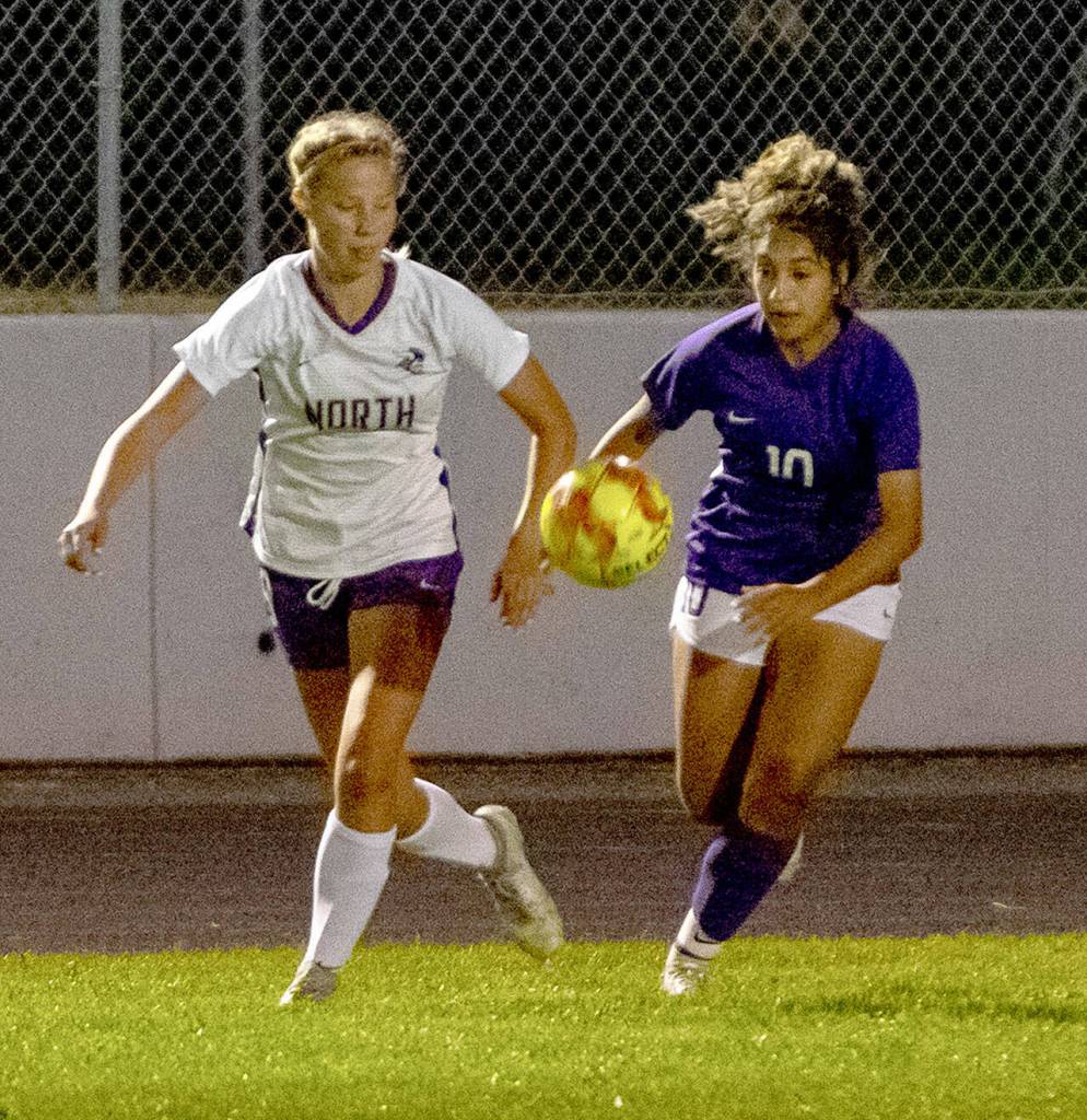 Sequims Jennyfer Gomez, right, and North Kitsaps Natalie Holmberg vies for the ball in Sequims 2-0 home win on Sept. 16. Sequim Gazette photo by Emily Matthiessen
