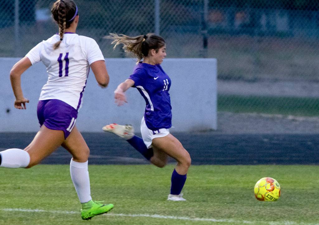 Sequims Alliyah Weber, right, looks to strike the ball as Tyra Zetty of North Kitsap looks on, in Sequims 2-0 win on Sept. 16. Sequim Gazette photo by Emily Matthiessen