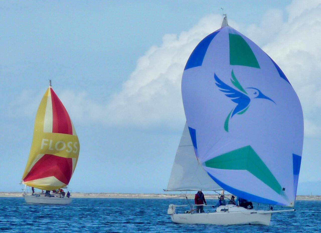 Mike Kalahar of Port Angeles at the helm of Litonya, takes top honors in the 2021 Reach for Hospices racer class on Sept. 18. In the background is Denali, skippered by Bob Macaulay of Sequim. Photo by Anna Richmond, Gail Spurr