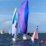 Litonya, skippered by Mike Kalahar of Port Angeles, is on the left, edging Windchild, skippered by Rudy Heessels of Sequim. In back, Sirius (Soren Prip), Denali (Bob Macaulay) and Pinafore (Bernie Armstrong), all of Sequim. Photo by Anna Richmond, Gail Spurr
