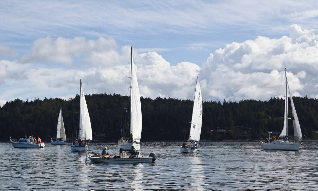 Sailboats gather near the starting line of the 2021 Reach for Hospice race on Sequim Bay on Sept. 18. Sequim Gazette photo by Michael Dashiell