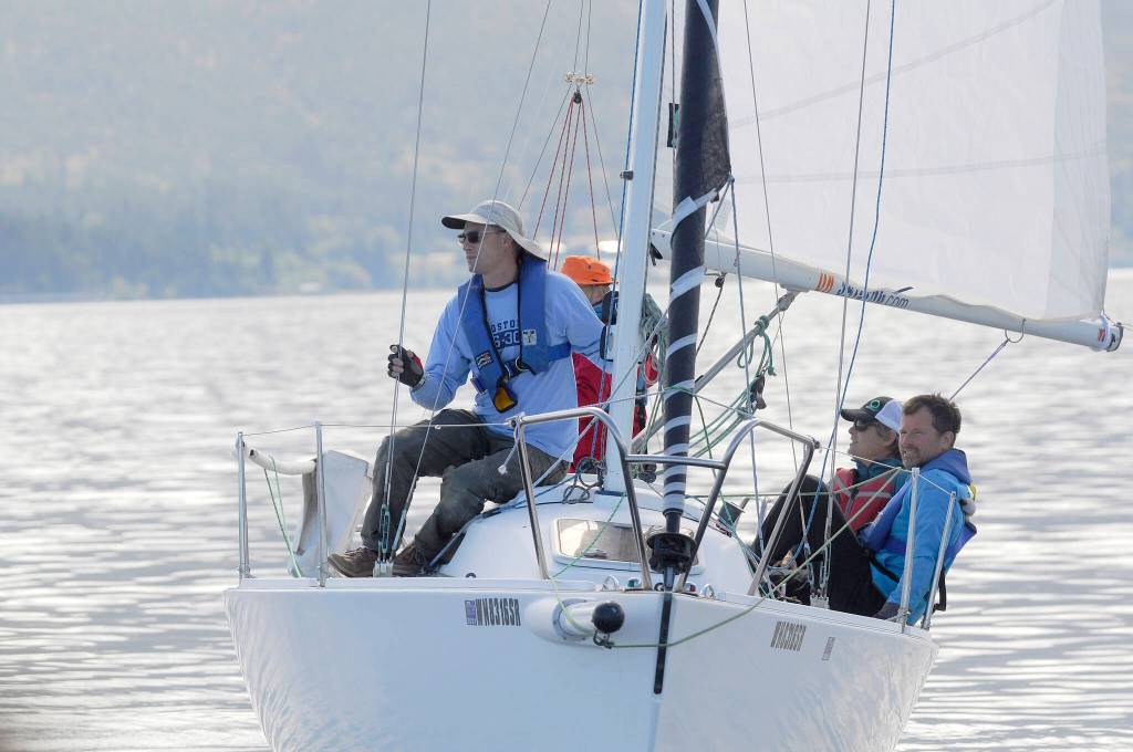 A calm before the race: Crew members of the Litonya prep for the 2021 Reach for Hospice competition on Sequim Bay on Sept. 8. Pictured, from left, are Nick Benge, skipper Mike Kalahar, Dan Kasseler and Greg Halberg. Sequim Gazette photo by Michael Dashiell