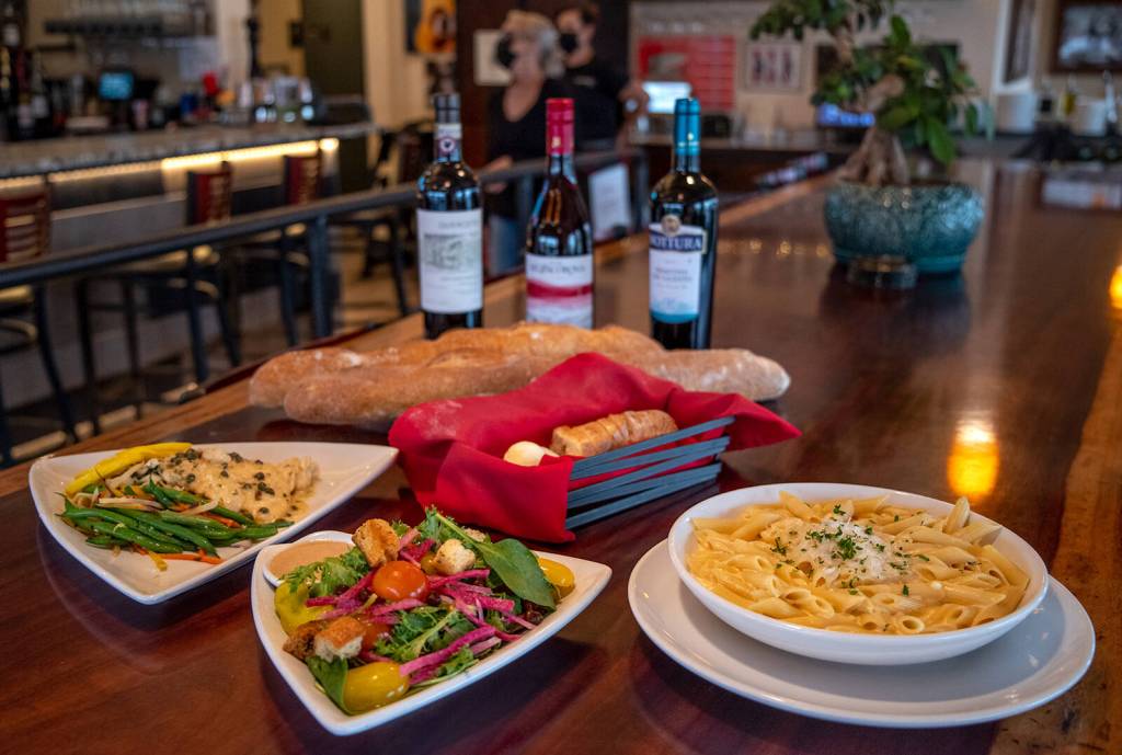 People who donate to WAGs Dogtoberfest fundraiser this year can choose between two dishes from Tedescos Italian Fresh. On the left is Chicken Piccata with potatoes and vegetables, in the middle the Misto Salad that comes with either meal, and on the right Vegetarian Penne Asiatico. Both meals come with bread and dessert. Tedescos co-owner Tina Thomson said, We love WAG and admire what they do. Meals must be pre-ordered from WAGs website by Oct. 13. Sequim Gazette photo by Emily Matthiessen