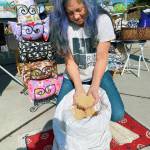 KarenLynnn Robinson shows some of the millet hull filling that goes into a BlissPillow. Photo by Emma Jane EJ Garcia