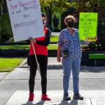 I want life to get back to normal, said Natalie Elfant, holding a green sign on the right, and we cant do that until people get vaccinated and get rid of COVID and its variants. She and Pauline, left, attend a rally in Sequim on Sept. 18. I was in the military for 27 years, said Pauline, and I served my country and I really put my life on the line for the citizens of the United States…. why cant we do something simple like wear a mask or get one vaccine to save other lives? Thats all we have to do. Sequim Gazette photo by Emily Matthiessen