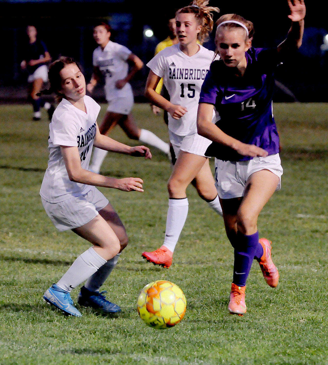 Sequims Hannah Wagner, right, advances the ball as the Wolves take on Bainbridge on Sept. 21 in Sequim, as Spartans Maddy Brown (10) and Savannah Mabee (15) look on. The Wolves held a 1-0 lead at halftime but fell to the visiting Spartans on penalty kicks. Sequim Gazette photo by Michael Dashiell