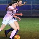 Sequims Rileigh VanDyken, right, vies for the ball with Bainbridges Laine Romney in the Wolves home loss on Sept. 21. Sequim Gazette photo by Michael Dashiell
