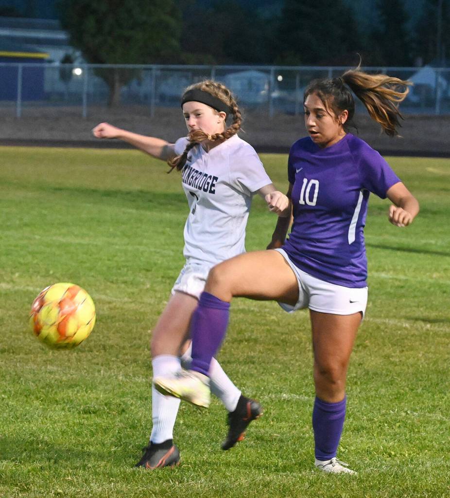 Sequims Jennyfer Gomez, right, vies for the ball with Bainbridges Gabby Weis in the Wolves home match-up on Sept. 21. Bainbridge won on penalty kicks after the teams were knotted 1-1 at the end of regulation. Sequim Gazette photo by Michael Dashiell