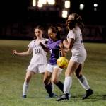 Sequim midfielder Taryn Johnson, center, vies for possession with Bainbridges Maddy Brown (10) and Ellie Murray (11) in the second half of the Wolves match-up with the 3A Spartans on Sept. 21. Sequim Gazette photo by Michael Dashiell