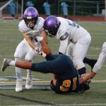 Toppy Robideau and Faas Christianson team up to make the tackle on Bainbridge quarterback Jack Grant in a Sept. 24 match-up.