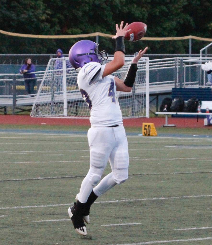 Sequims Ricky Jennings turns back to make the reception before turning upfield against Bainbridge in a Sept 24 Olympic League match-up. Bainbridge won, 48-10. Photo by Mark Krulish/Kitsap News Group