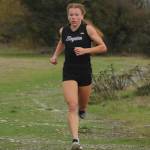 Sequims Riley Pyeatt leads the pack about midway through an Olympic League meet on Sept. 29 at the Dungeness Recreation Area. Pyeatt improved her time on the Sequim course from last years race by more than 20 seconds. Sequim Gazette photo by Michael Dashiell