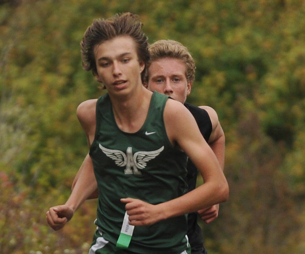 Sequims Colby Ellefson, right, keeps close to Port Angeles Maxwell Baeder near the end of the Sept. 29 Olympic League meet at the Dungeness Recreation Area. Ellefson edged Baeder by 1.2 seconds for second place. Sequim Gazette photo by Michael Dashiell