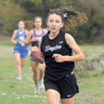 Sequim sophomore Kaitlyn Bloomenrader finished fifth for Sequim in an Olympic League cross-country meet held at Voice of America at Dungeness Recreation Area on Sept. 29. Sequim Gazette photo by Michael Dashiell