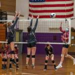 Sequims Jolene Vaara (25) and Jordan Kidd (49) look to block a hit in the Wolves 3-1 win over visiting Kingston on Sept. 28. Sequim Gazette photo by Emily Matthiessen