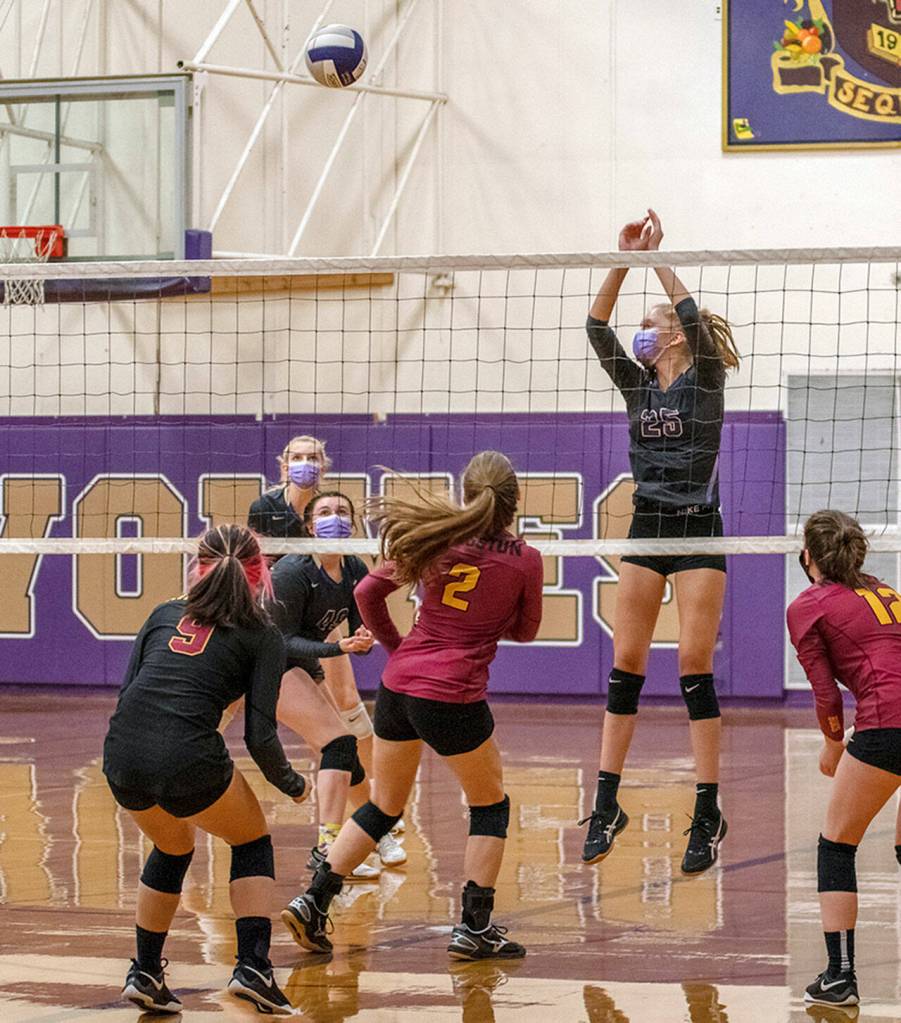 From back left: Sequims Kendall Hastings, Jordan Kidd and Jolene Vaara keep an eye on the ball as the Wolves take on  and beat  Kingston on Sept. 28. Sequim Gazette photo by Emily Matthiessen